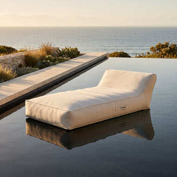 Poolboy Floata-Long in Cloud white on the water.