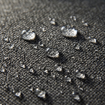 Water beading on the solution-dyed Olefin fabric of the Poolboy Floata-Long in Dusk charcoal.