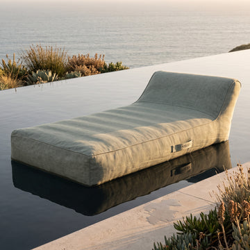 Poolboy Floata-Long in Mist grey on the water.