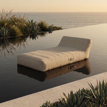 Poolboy Floata-Long in Natural beige on the water.
