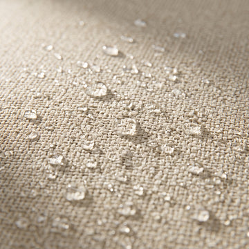 Water beading on the solution-dyed Olefin fabric of the Poolboy Floata-Long in Natural beige.