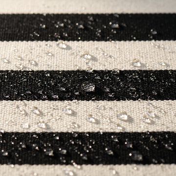 Water beading on the solution-dyed Olefin fabric of the Poolboy Floata-Long in Black and White stripe.