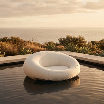 Poolboy Floata-Round in Cloud white on the water.