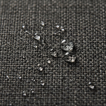 Water beading on the solution-dyed Olefin fabric of the Poolboy Floata-Round in Dusk charcoal.
