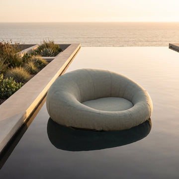 Poolboy Floata-Round in Mist grey on the water.