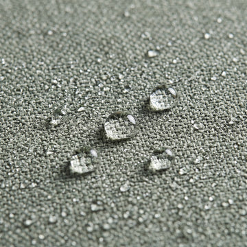 Water beading on the solution-dyed Olefin fabric of the Poolboy Floata-Round in Mist grey.