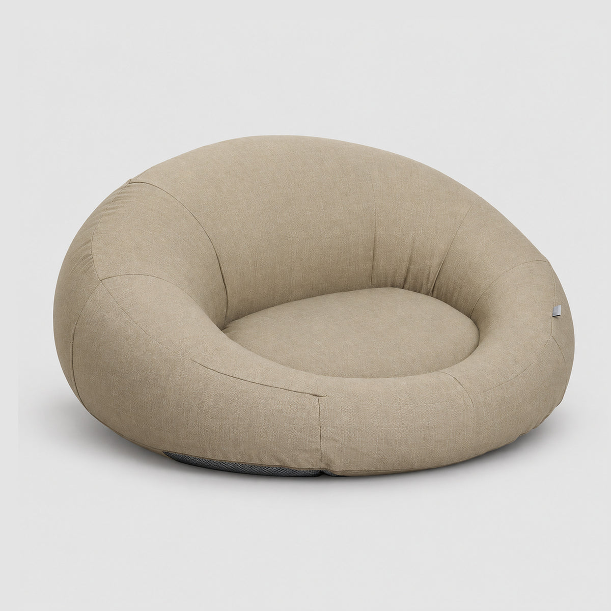 Poolboy Floata-Round in Natural beige, three-quarter view.