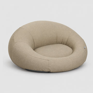 Poolboy Floata-Round in Natural beige, three-quarter view.