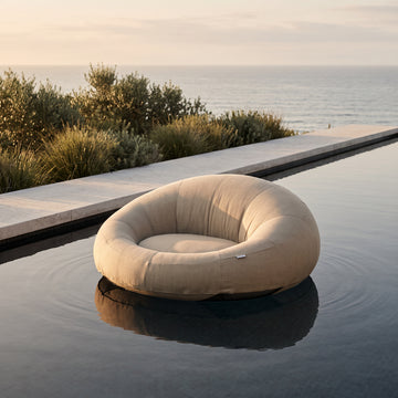 Poolboy Floata-Round in Natural beige on the water.