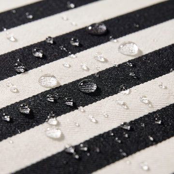 Water beading on the solution-dyed Olefin fabric of the Poolboy Sinka-Bit in Black and White stripe.