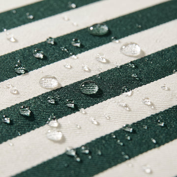 Water beading on the solution-dyed Olefin fabric of the Poolboy Sinka-Bit in Green and White stripe.