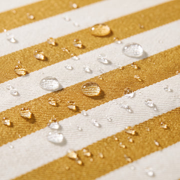 Water beading on the solution-dyed Olefin fabric of the Poolboy Sinka-Bit in Yellow and White stripe.